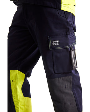 Multinorm Arbeitshose von vorne im Detail in Marineblau / High Vis gelb